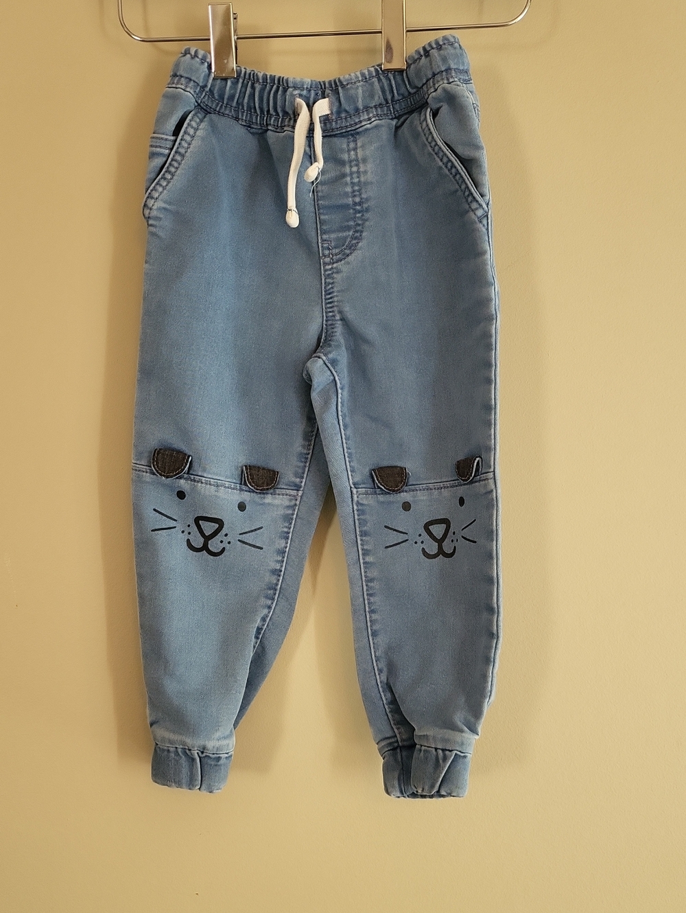 Joe Fresh denim joggers with cat face knees